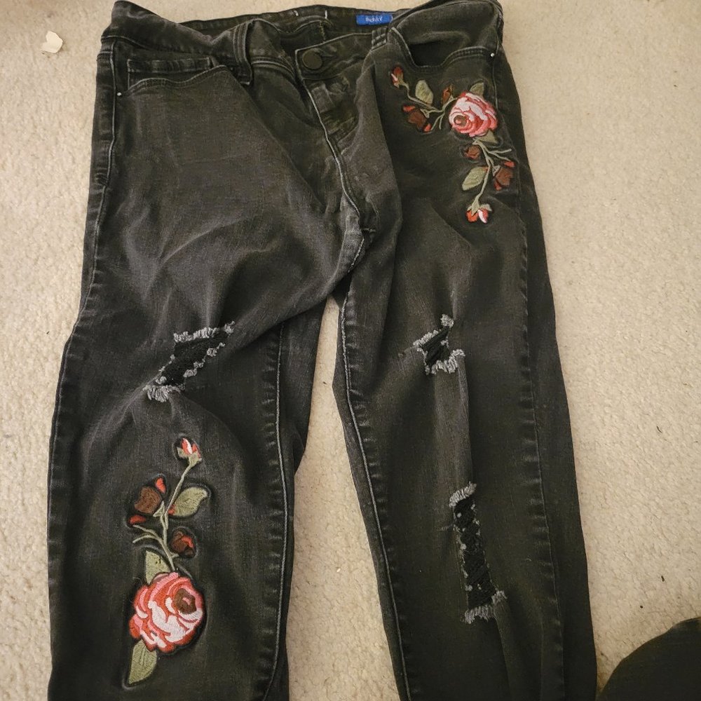 Black jeans with embroidered rose